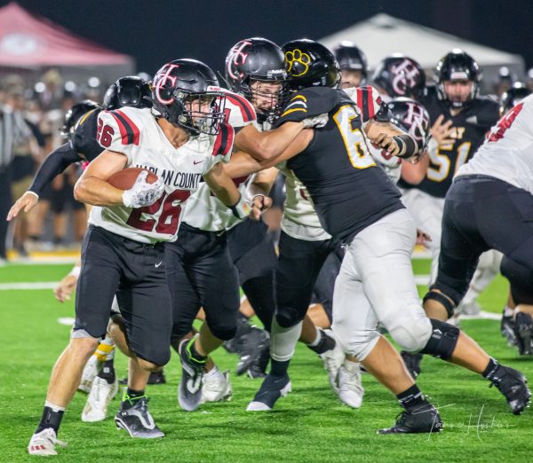 Harlan County junior running back James Ryan Howard followed a block in Friday’s game at Clay County. The Tigers pulled away in the second half for a 36-16 victory. The 0-4 Bears return to action Friday at home against Lawrence County.
