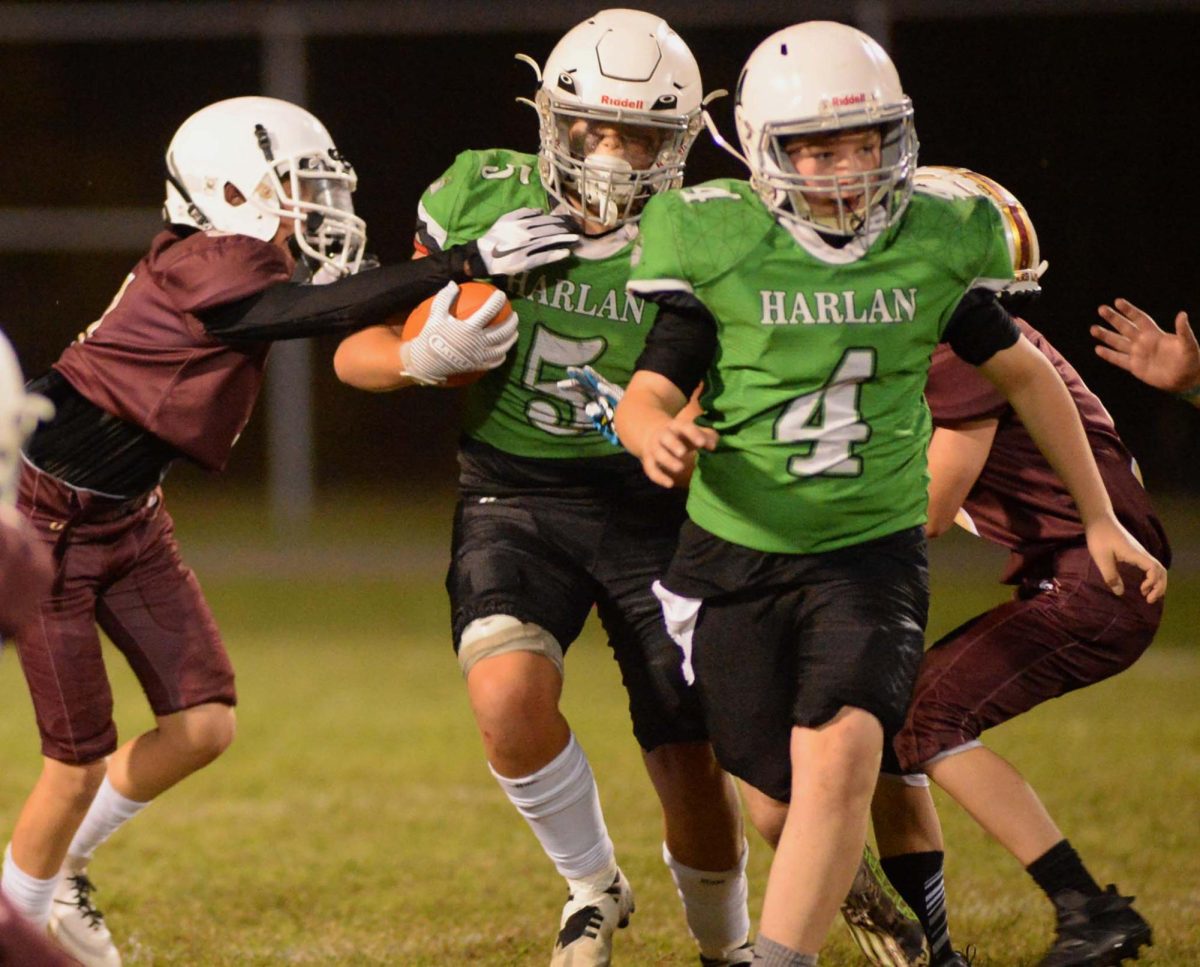 Ryder Lemarr followed a block from Isaiah Caudill in fifth- and sixth-grade football action against Pineville.