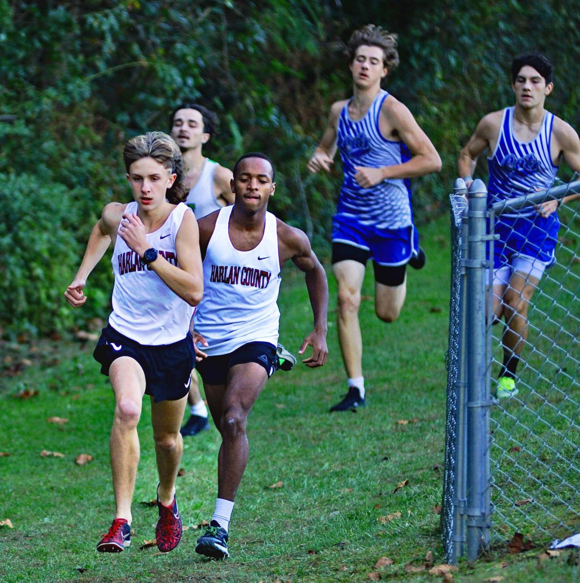 Harlan Countys Tanner Daniels and Jacob Schwenke are pictured during the Southeastern Kentucky Conference meet on Tuesday. Daniels was the top finisher in the boys division.