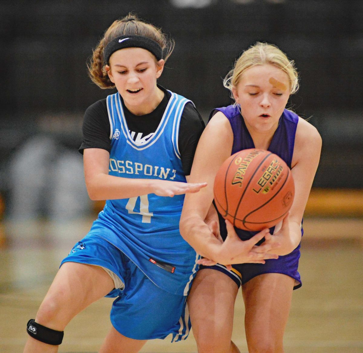 Rosspoints Reagan Clem and Wallins Brooklyn Haywood went after a loose ball in the seventh- and eighth-grade county finals Thursday.