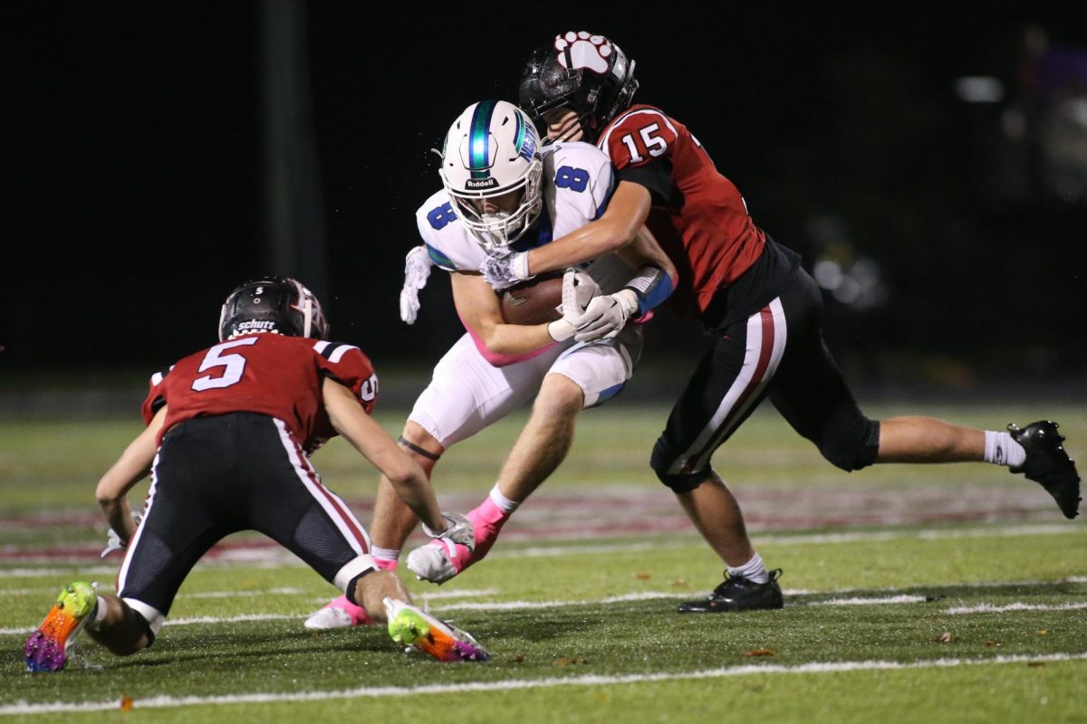 Harlan+County+defensive+backs+Jacob+Sage+and+Gage+Bailey+moved+in+to+tackle+North+Laurels+Cole+Messer+in+Fridays+game.