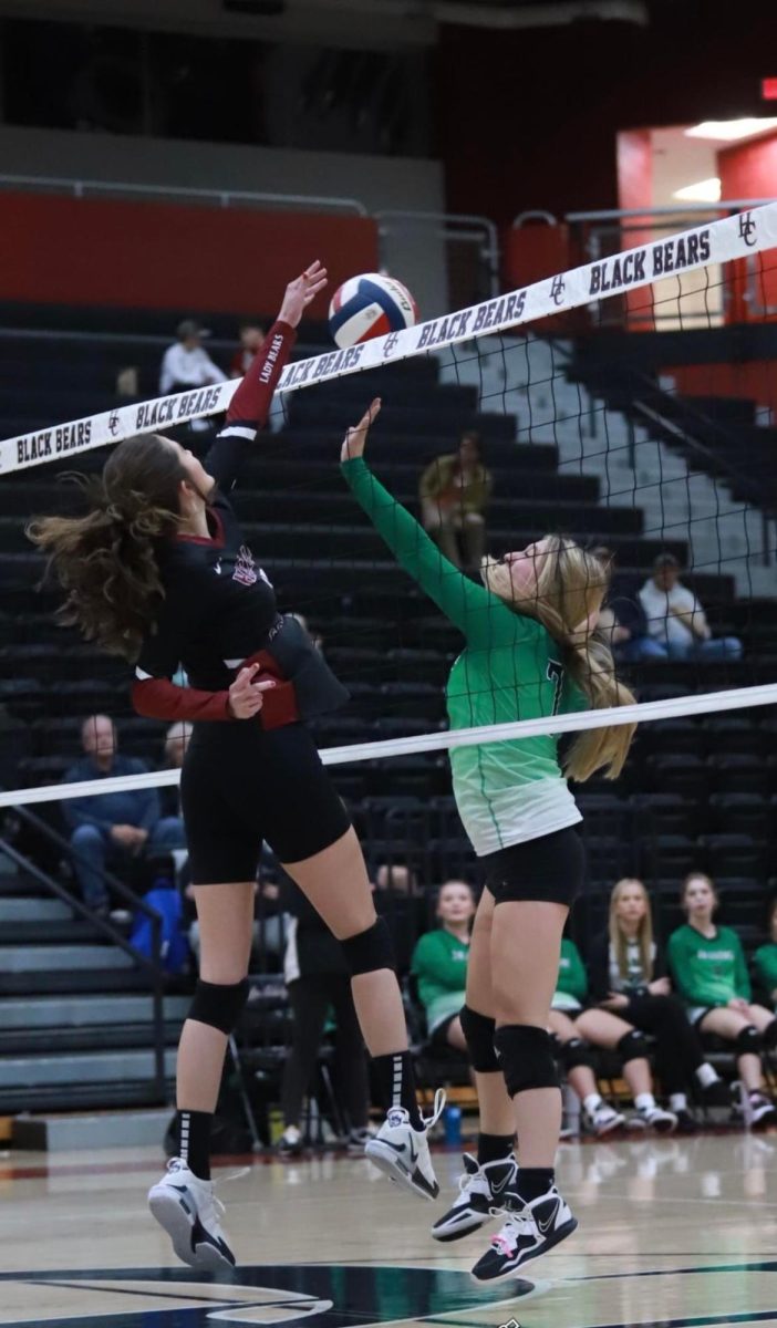 Harlan County senior Destiny Cornett went to the net to finish off a point against Harlan’s Kaylee Roark in action from the 52nd District Tournament. The Lady Bears advanced with a three-set victory.