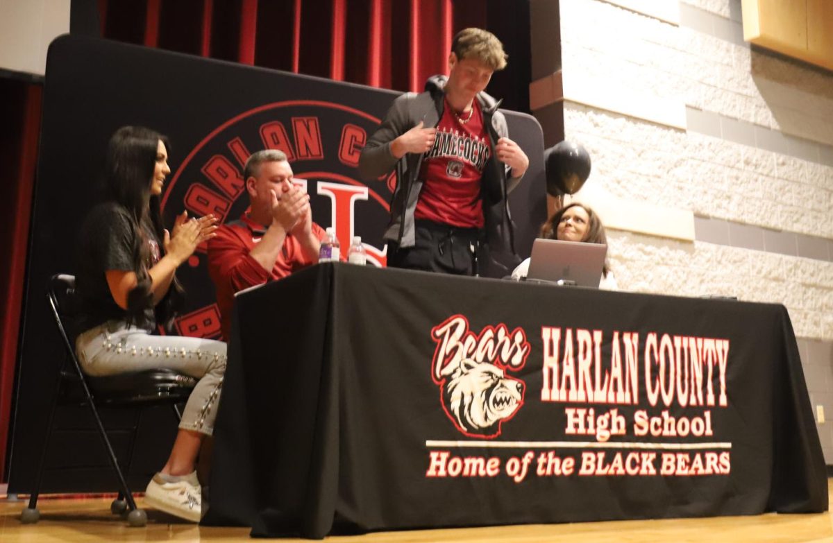 Harlan County senior guard Trent Noah announced recently he would continue his basketball/academic career at South Carolina. Noah is pictured with his parents, Dondi and Stacy, and his sister, Emersyn.
