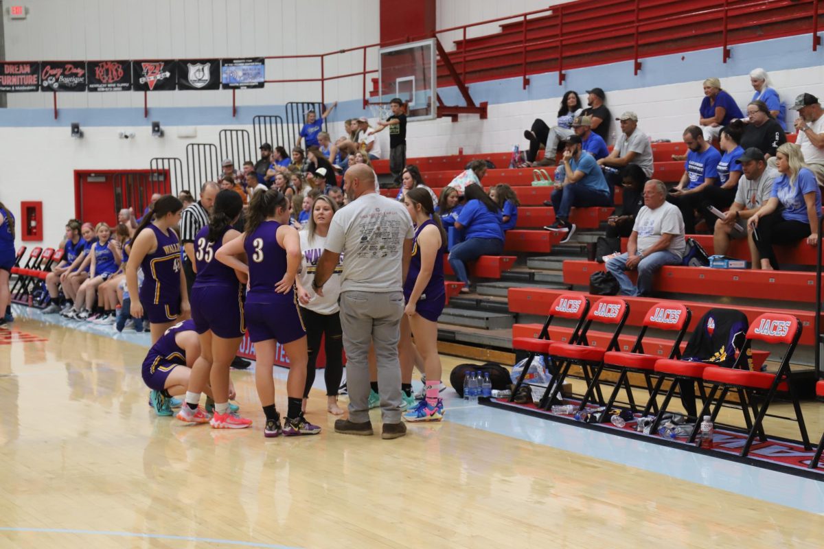 The Wallins Lady Devils discussed strategy in action from the seventh- and eighth-grade county tournament on Tuesday at James A. Cawood Elementary School.