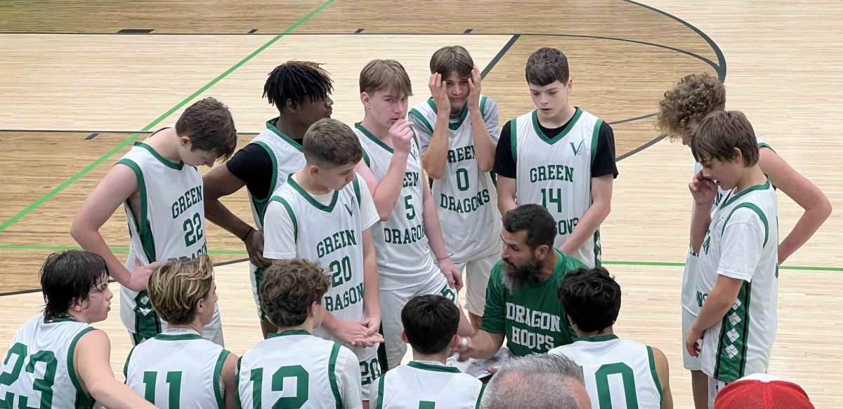 Harlan+coach+Paul+Hearld+talked+with+his+team+during+a+timeout+on+Friday+in+the+Green+Dragons+61-49+win+over+visiting+Lee%2C+Va.