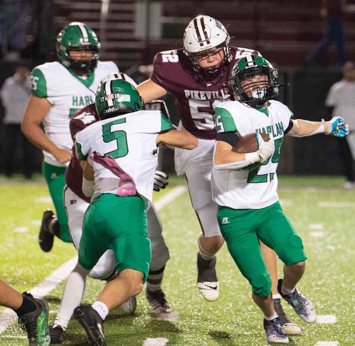 Harlan running back Jonah Sharp followed a block from Brayden Doan in playoff action Friday at Pikeville. The Panthers moved on to the second round with a 49-6 win.
