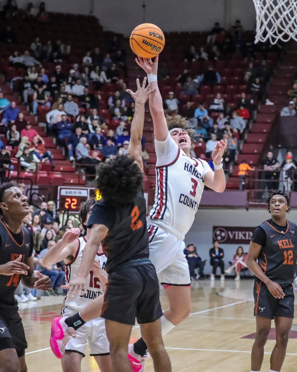 Harlan County guard Maddox Huff put up a shot in action against Kell, Ga., on Friday in the Arby's Classic in Bristol. Huff led the Bears with 23 points in a 93-68 to the defending Georgia 5A state champs.