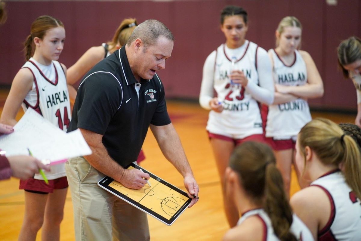 Harlan County coach Anthony Nolan talked with his team during the Lady Bears win Thursday over Providence Academy, Tenn. It was the 400th victory for Nolan in his 22-year coaching career.