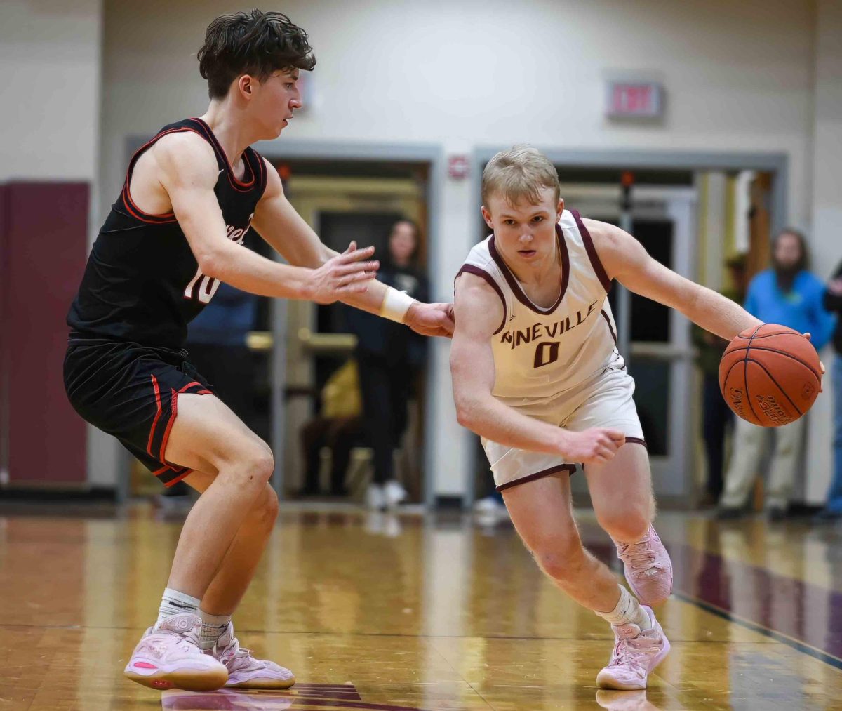 Pineville guard Sawyer Thompson drove around Powell Countys Dylan Carter in championship game action Saturday at the Chain Rock Classic. Thompson scored 25 points in the Mountain Lions 84-73 win.
