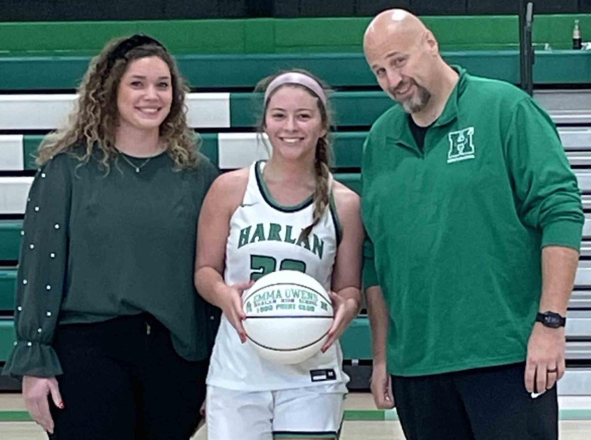 Harlan+senior+guard+Emma+Owens+received+a+commemorative+basketball+for+joining+the+programs+1%2C000-point+club+with+a+basket+at+the+2%3A50+mark+of+the+second+quarter+in+Saturdays+game+against+Belfry.+Owens+is+pictured+with+coach+Mackenzie+King+Varner+and+HHS+Principal+Britt+Lawson.
