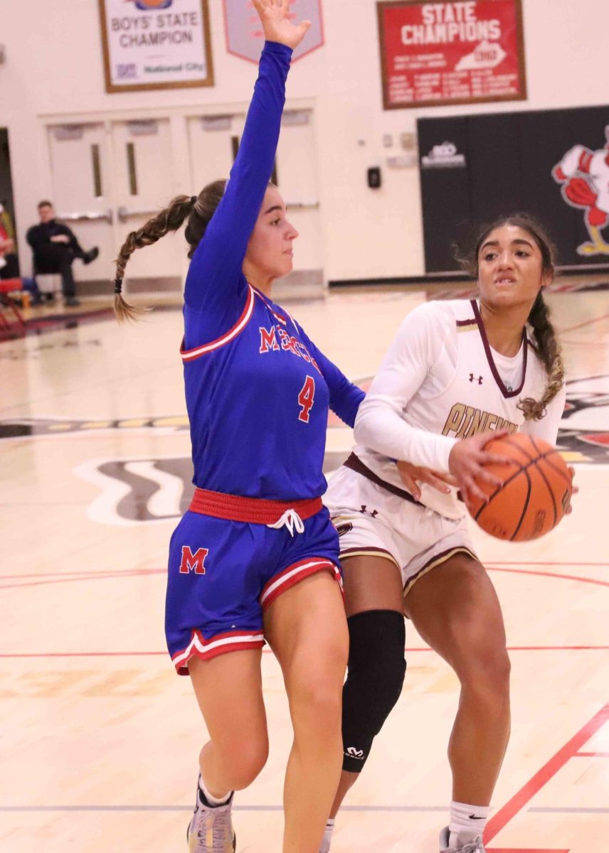Pineville guard Nadine Johnson went up for a shot against Mercer Countys Anna Drakeford in the Lisa Collins Classic on Saturday at South Laurel.