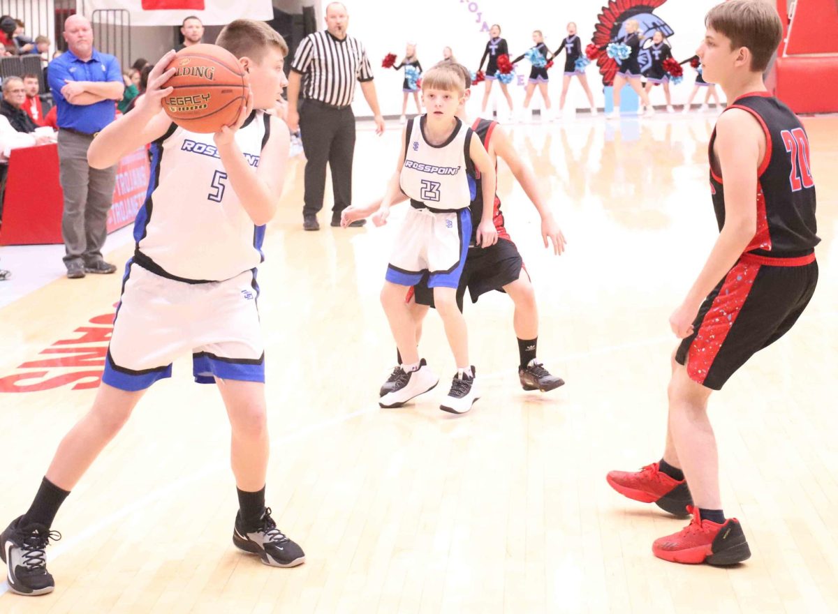 Rosspoints Hunter Stevens looked for an opening against James A. Cawoods Danny Templeton in Mondays seventh- and eighth-grade game.