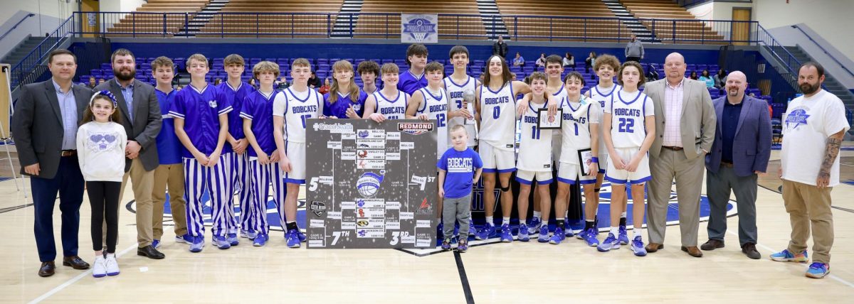 The Bell County Bobcats are pictured with the championship trophy from the Short-Redmond Holiday Classic after a 78-49 win over Scott County in the tournament finals.