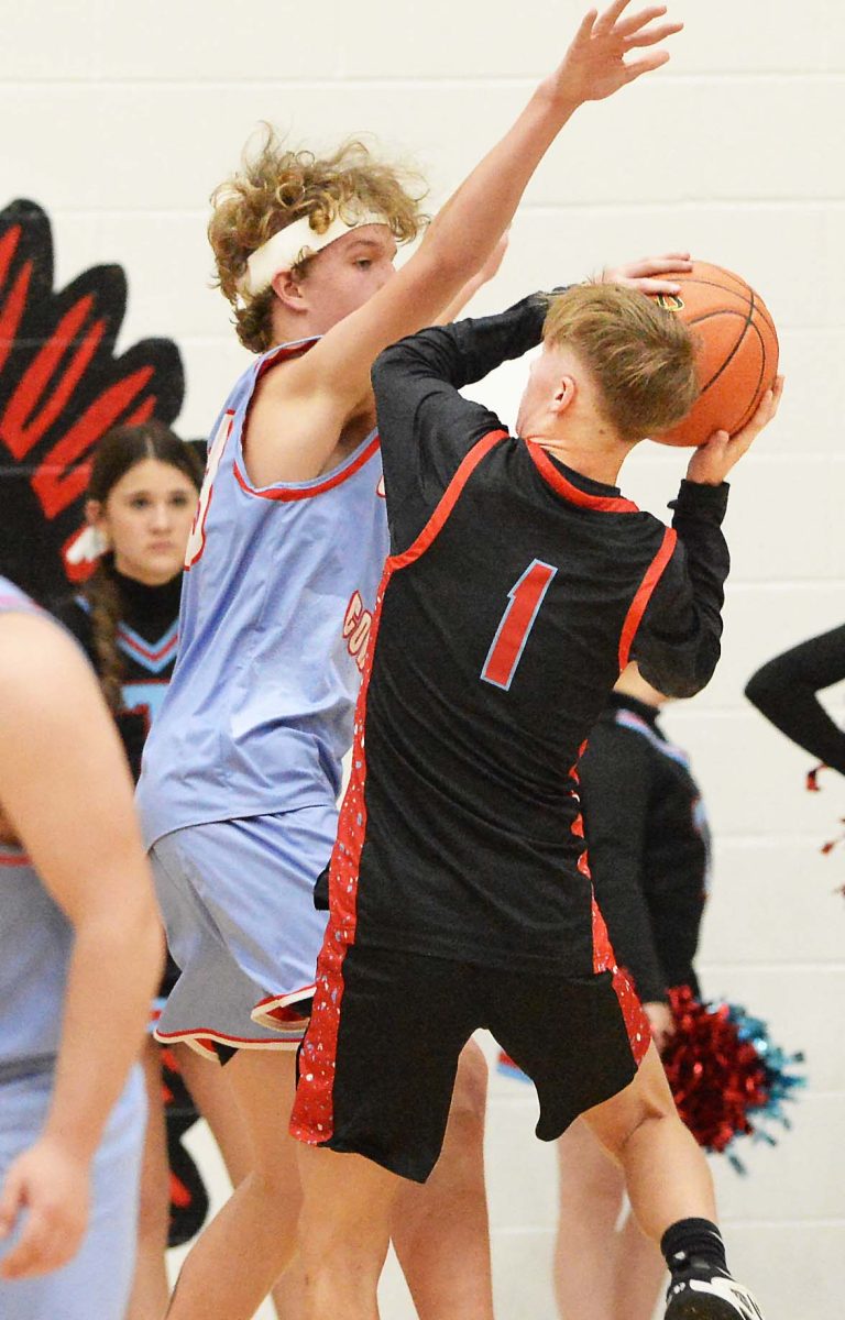 James A. Cawood guard Brayden Morris worked against a Cawood defender in action earlier this season. Morris and the Trojans advanced in the county tournament with a 45-10 win Tuesday over Green Hills.