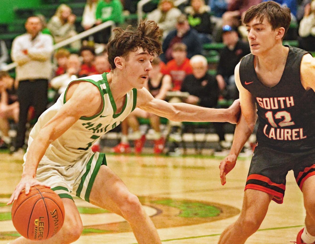 Harlan freshman guard Trent Cole, pictured in action Tuesday against South Laurel, scored 21 points on Saturday as the Green Dragons routed Red BIrd 82-26 in the quarterfinals of the 13th Region All A Classic.