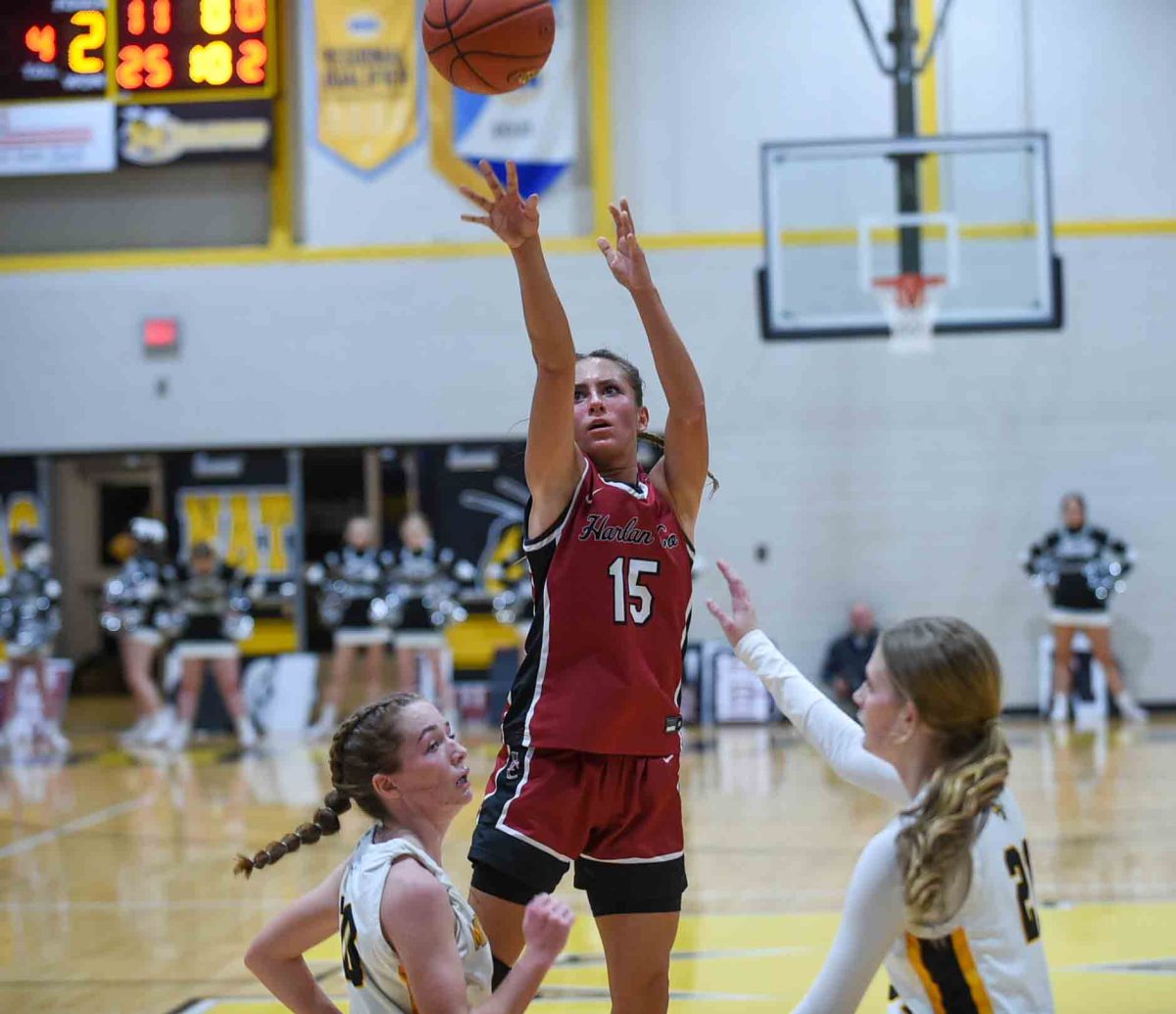Harlan County guard Ella Karst worked between two Middlesboro defenders on Friday for two of her 29 pointsi in the Lady Bears 48-39 victory.