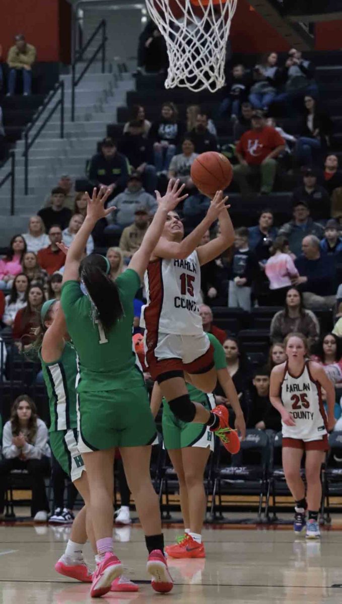 Harlan County senior guard Ella Karst sailed to the basket for two of her 39 points on Monday in the Lady Bears 66-60 overtime win over visiting Harlan.