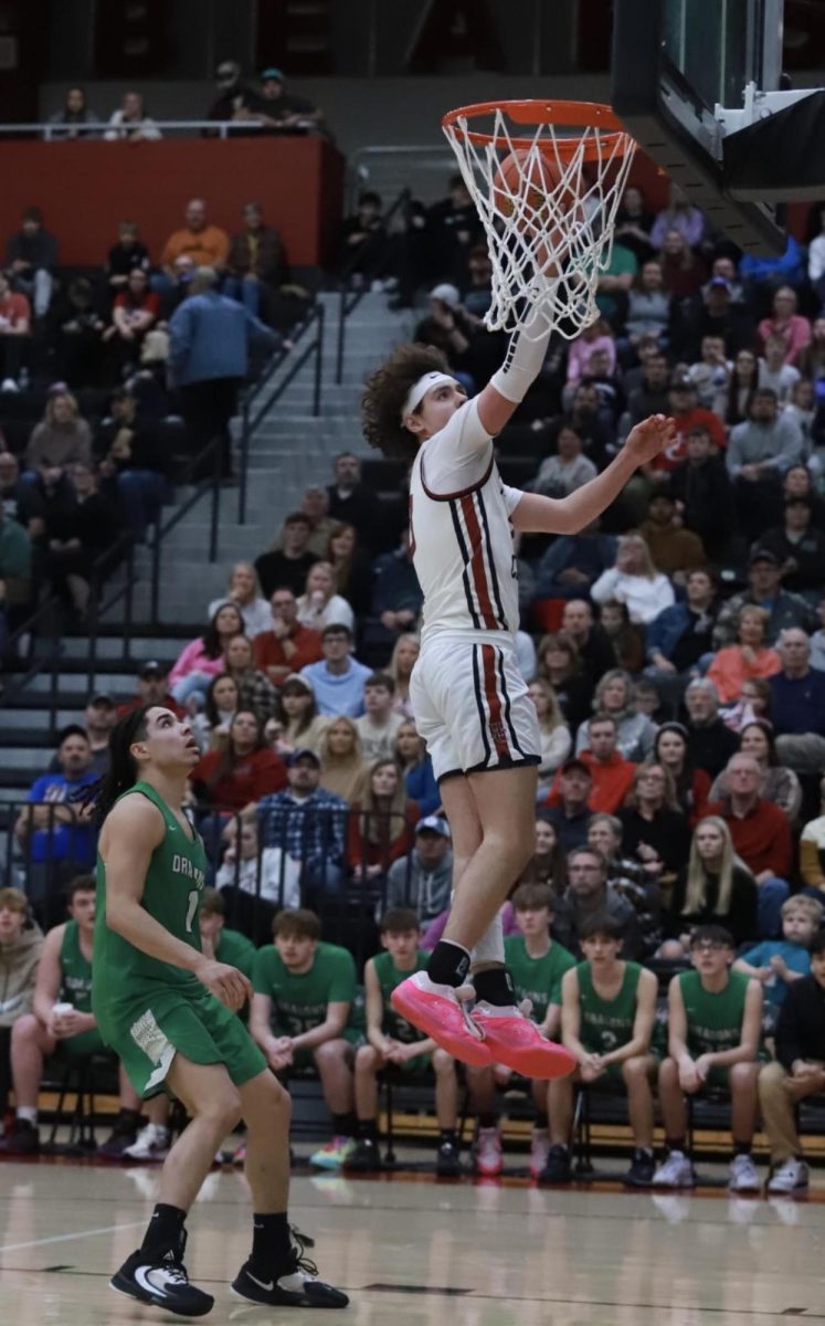 Harlan County guard Maddox Huff went up for two of his 21 points on Monday in the Bears 88-63 win over visiting Harlan.