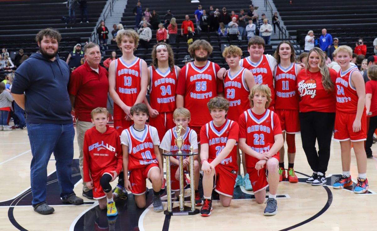 The Cawood Comets are pictured with the championship trophy after their thrilling 48-47 win Thursday over James A. Cawood in the seventh- and eighth-grade finals at Harlan County High School.