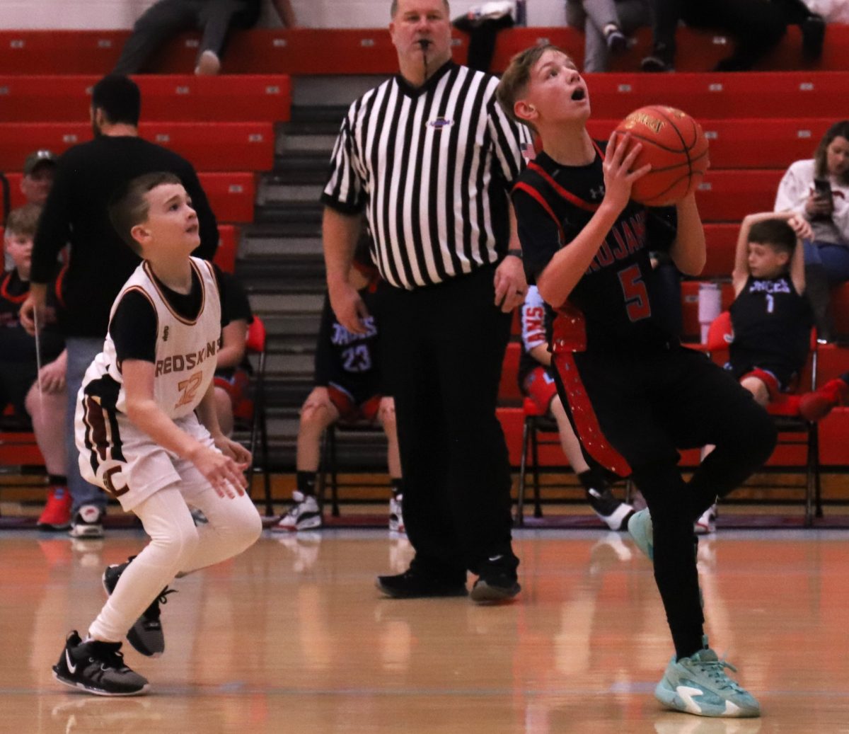 James A. Cawoods Logan Mills went up for a shot during the Trojans 46-5 win over Cumberland in the fifth- and sixth-grade county tournament on Saturday.