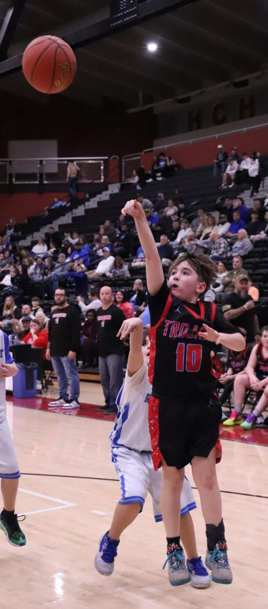 James A. Cawood guard Seth Johnson put up a shot in action from the fifth- and sixth-grade county championship game Thursday.