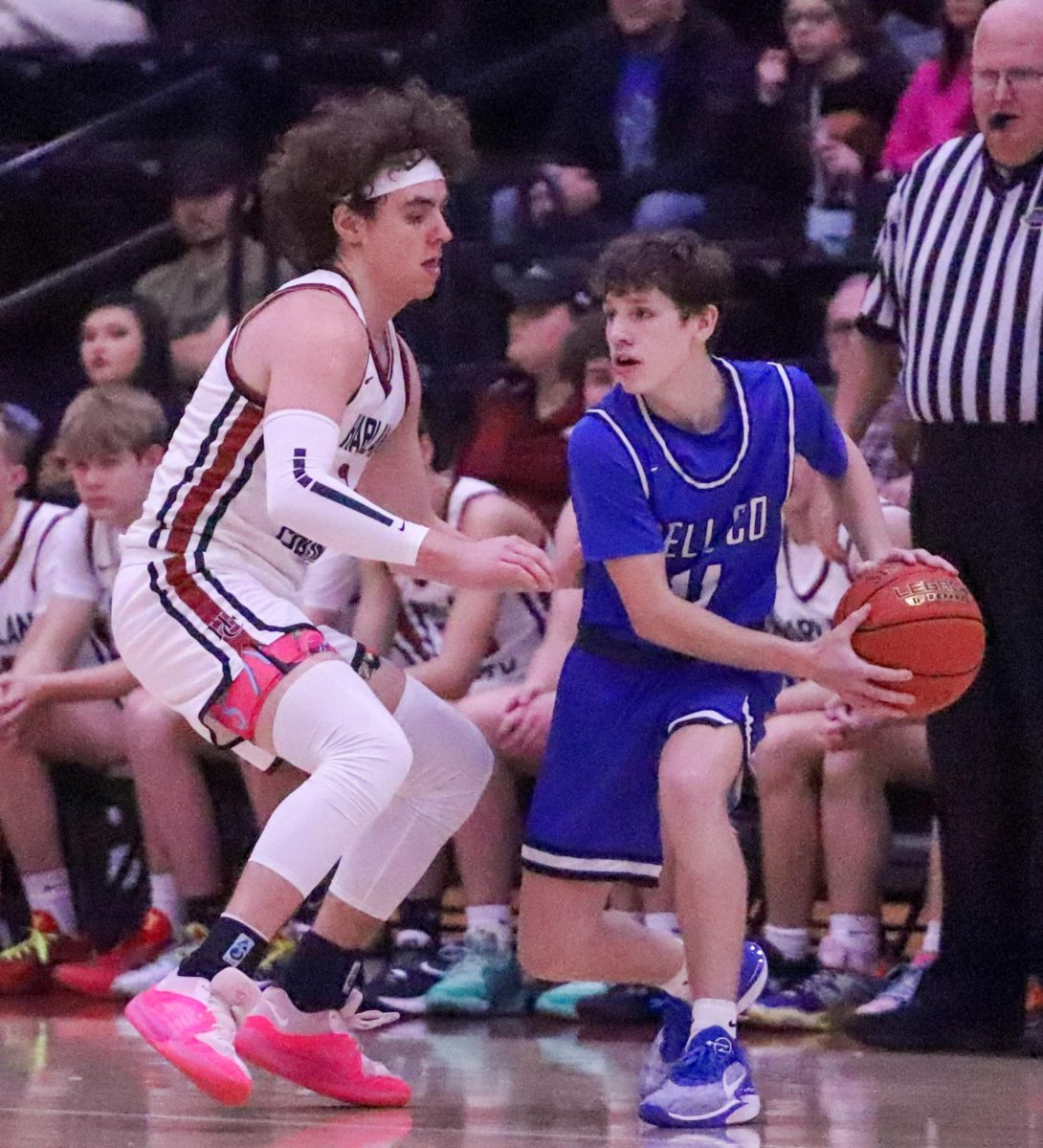 Bell County freshman guard Jaxon Thomas looked for a teammate as Harlan Countys Maddox Huff defended in Tuesdays district clash.