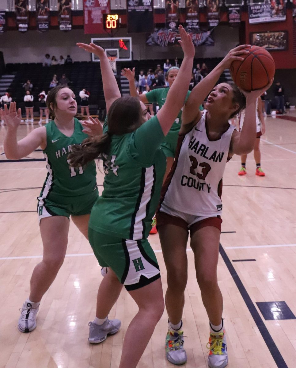 Harlan County senior forward Paige Phillips worked inside against Harlans Gracie Hensley and Addison Campbell in Mondays district clash. Phillips had nine points and six rebounds in the Lady Bears 66-60 win.