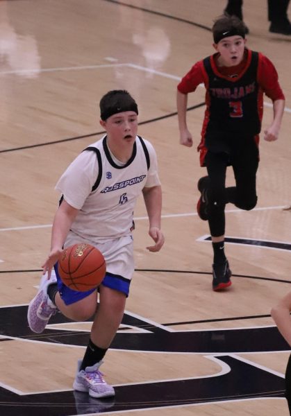 Rosspoints Carson Sanders headed down the court Thursday in action from the fifth- and sixth-grade county tournament finals. Rosspoint downed South Laurel 49-35 on Friday in regional tournament action in London.