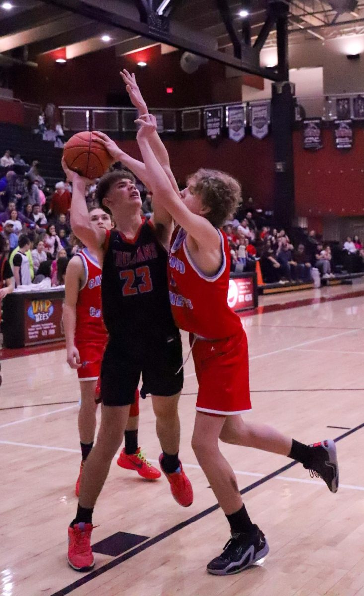James A. Cawoods Tyhler Coots and Cawoods Tucker Curtis battled inside during the seventh- and eighth-grade county championship game Thursday. Coots scored 11 points, while Curtis added seven.