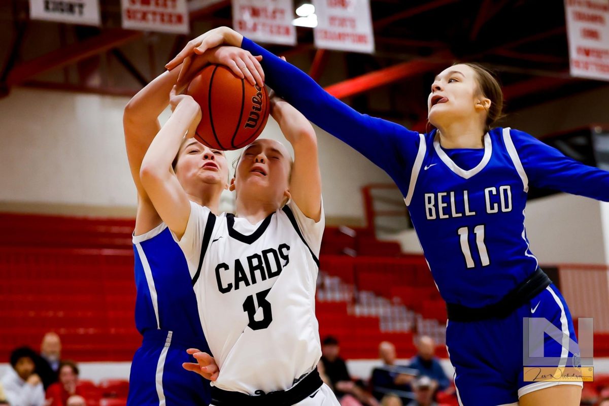 Bell Countys Kairi Lamb (left) and Gracie Wilder teamed for a block in Saturdays game at South Laurel.