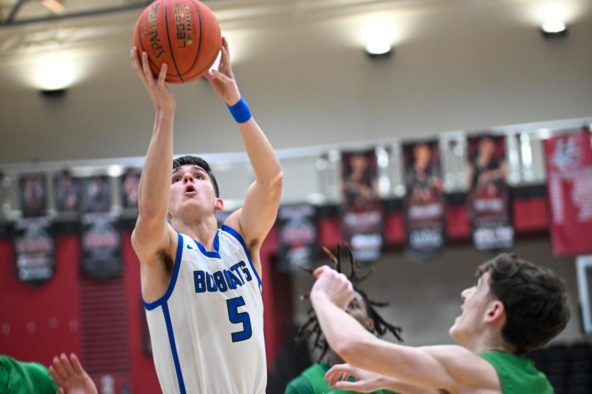 Bell County guard Blake Burnett went to the basket for two of his 24 points to lead the Bobcats to a 74-57 win over Harlan in the 52nd District Tournament.