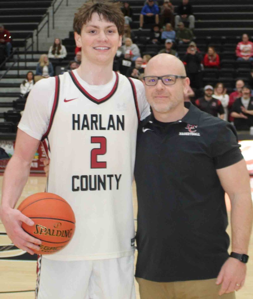 Harlan County guard Trent Noah received the game ball from HCHS coach Kyle Jones after breaking the county scoring record.