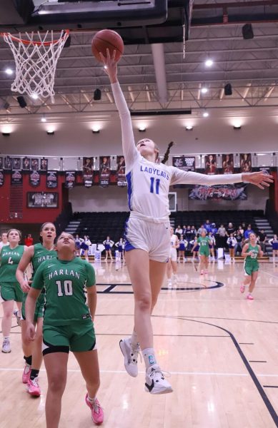 Bell Countys Gracie Jo Wilder sailed to the basket for two of her 27 points on Thursday in the Lady Cats 60-54 win over Harlan in the 52nd District Tournament finals.