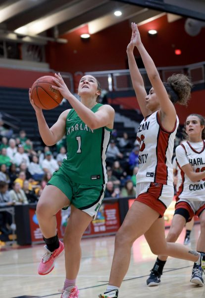 Harlan junior forward Kylie Noe powered her way to the basket for two of her 23 points in the Lady Dragons 57-55 win over Harlan County on Monday in the first round of the 52nd District Tournament.