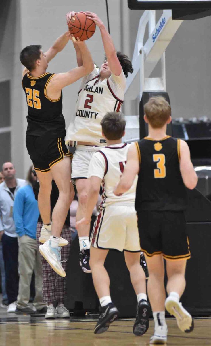 Harlan Countys Trent Noah blocked a Hayden Harris in the closing seconds of the Bears 66-60 win over Clay County in the 13th Region Tournament semifinals on Saturday.