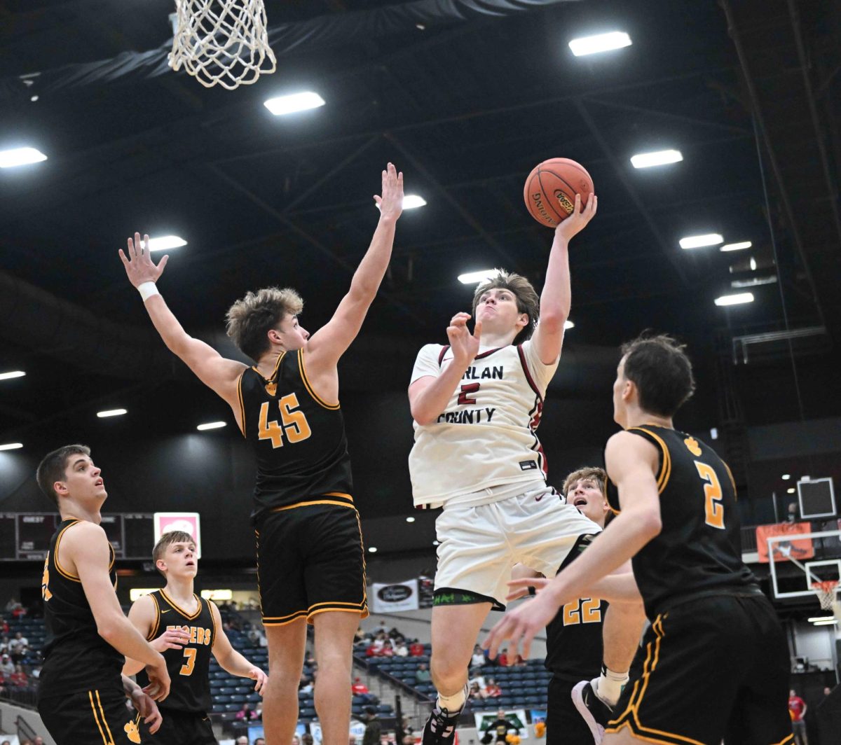 Harlan County guard Trent Noah lofted a shot toward the basket as all five Clay County defenders surrounded him in action from the 13th Region Tournament on Saturday.