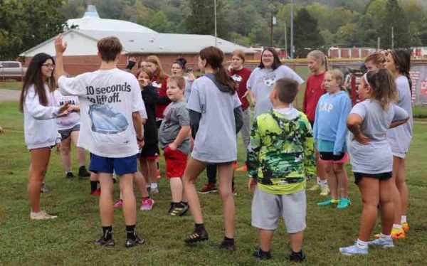 Harlan County High School girls soccer coach Hannah Pittman worked with several young players in preparation for the county soccer league opening next week at the Evarts Elementary School field.
