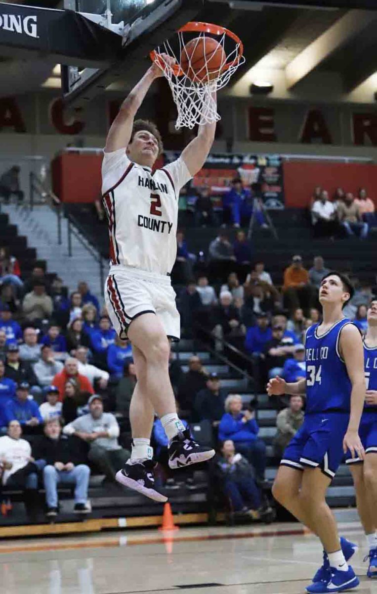 Harlan County senior guard Trent Noah slammed home one of his two dunks off turnovers in the opening 64 seconds of the 52nd District Tournament championship game Friday. Noah earned tournament most valuable player honors with 33 points in the Bears 77-54 victory.