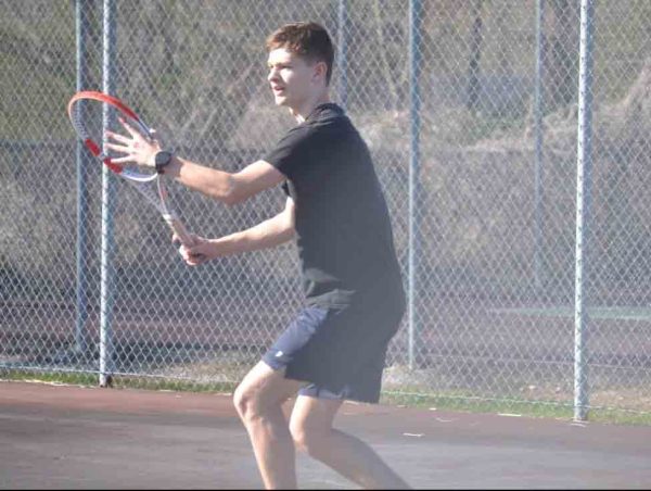 Harlan Countys Elijah Moore is pictured in tennis action this week.