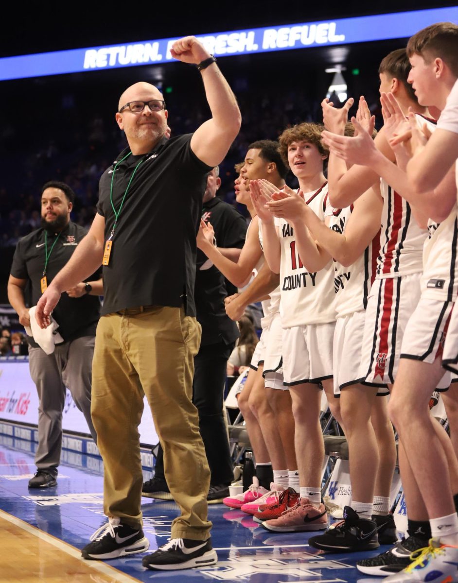 Harlan+County+coach+Kyle+Jones+shared+a+moment+with+the+large+cheering+section+on+hand+at+Rupp+Arena+in+the+final+moments+of+the+Bears+67-59+win+over+defending+state+champ+Warren+Central.
