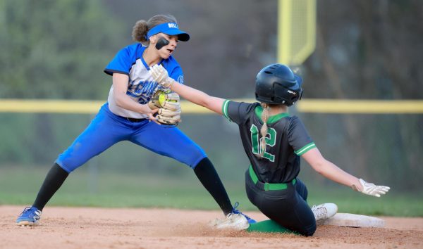 Harlans Mallory McNiel slid into second base as Bell Countys Jayda Boateng took the throw. The Lady Dragons rolled to a 20-8 win.
