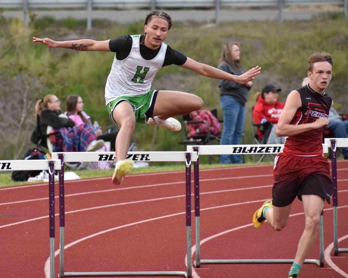 Harlan senior Tayquan Vick cleared a hurdle in a meet at Leslie County.