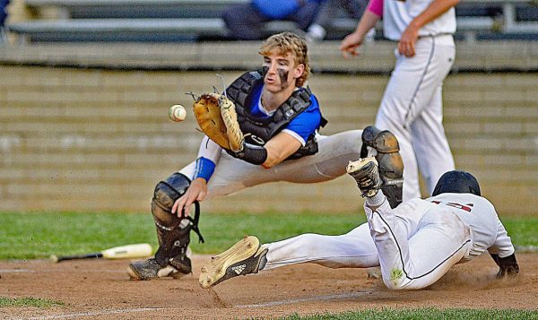 Harlan Countys Samuel Henson slid home just ahead of the throw to Bell County catcher Joseph Brigmon in Tuesdays district clash. Bell scored two runs in the seventh inning to edge the Bears 8-6. HCHS pulled even after falling behind 5-0 in the first inning.