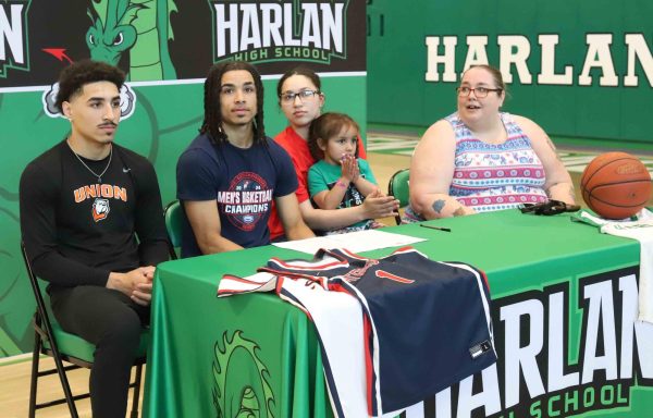 Harlan guard Kyler McLendon (second from left) signed with the University of the Cumberlands on Thursday after an outstanding high school career that placed him third in school history in scoring.