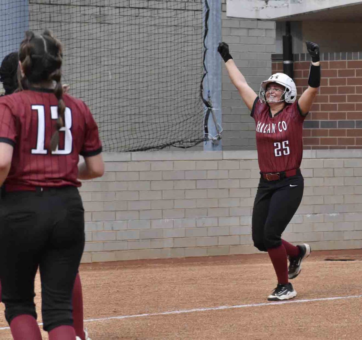 Harlan Countys Jade Burton celebrated after a home run Friday in the Lady Bears victory over Whitley County.