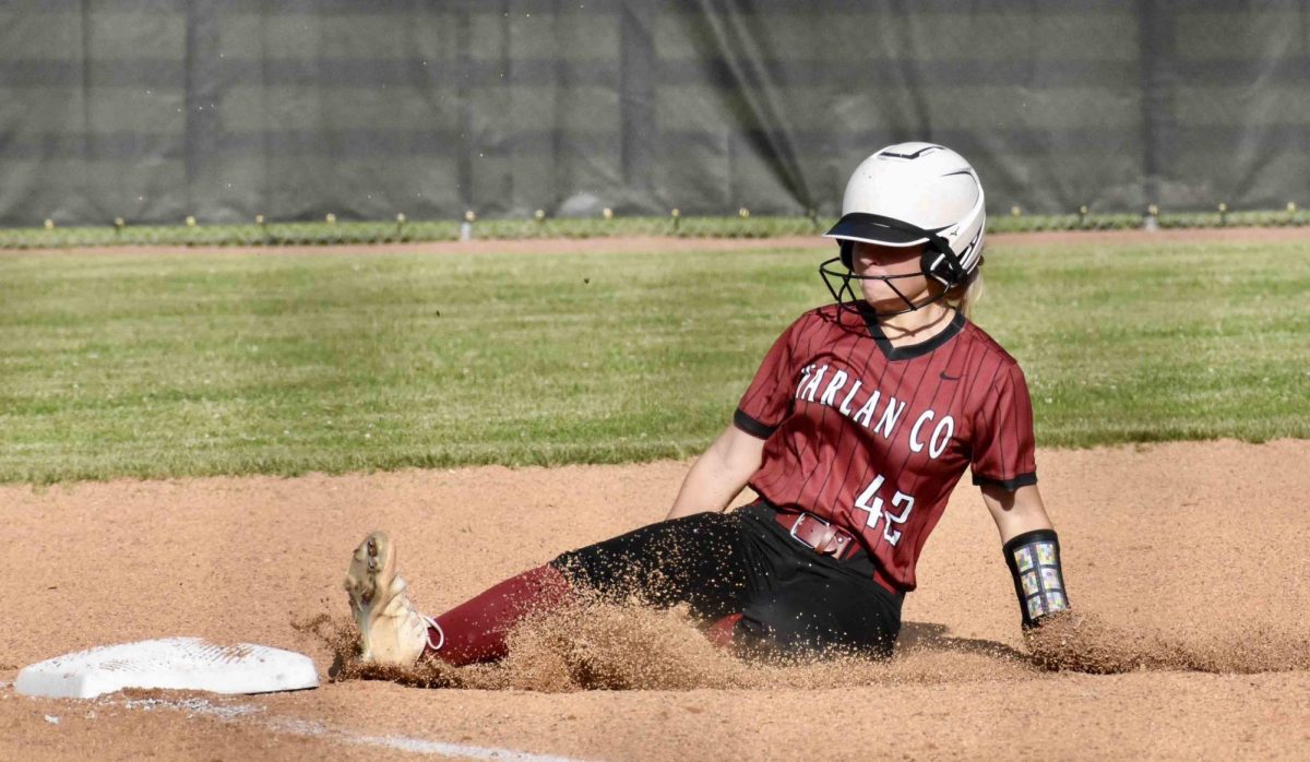 Harlan+County+center+fielder+Rylie+Maggard+slide+into+third+base+with+a+triple+to+open+the+second+inning+Monday+in+the+52nd+District+Tournament.+Harlan+County+advanced+to+a+championship+showdown+against+Harlan+with+an+11-4+win+over+Bell+County.
