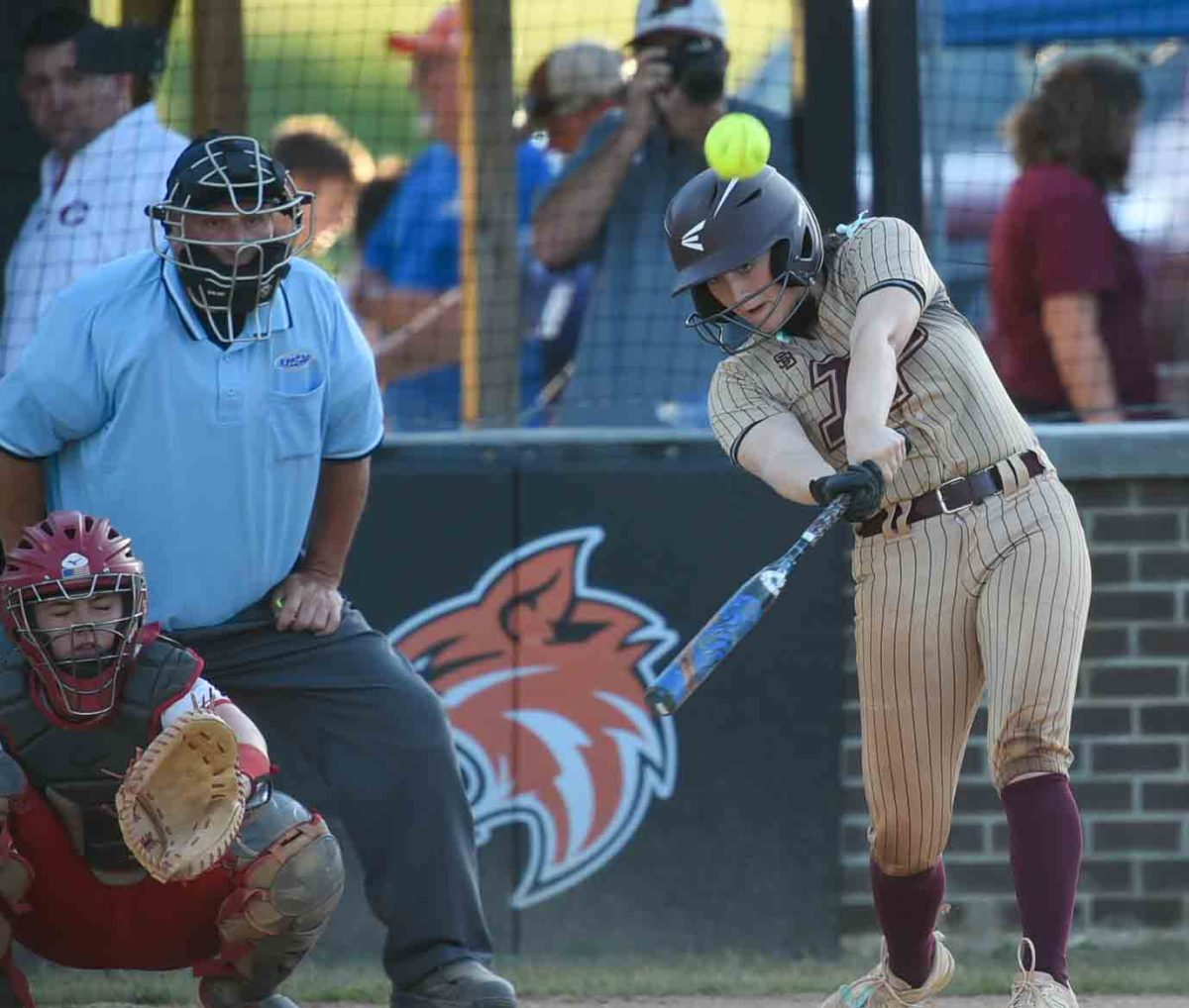 Pinevilles Addison Slone connected on a three-run homer in 13th Region Tournament action Tuesday. The Lady Hounds advanced with a 4-3 victory.