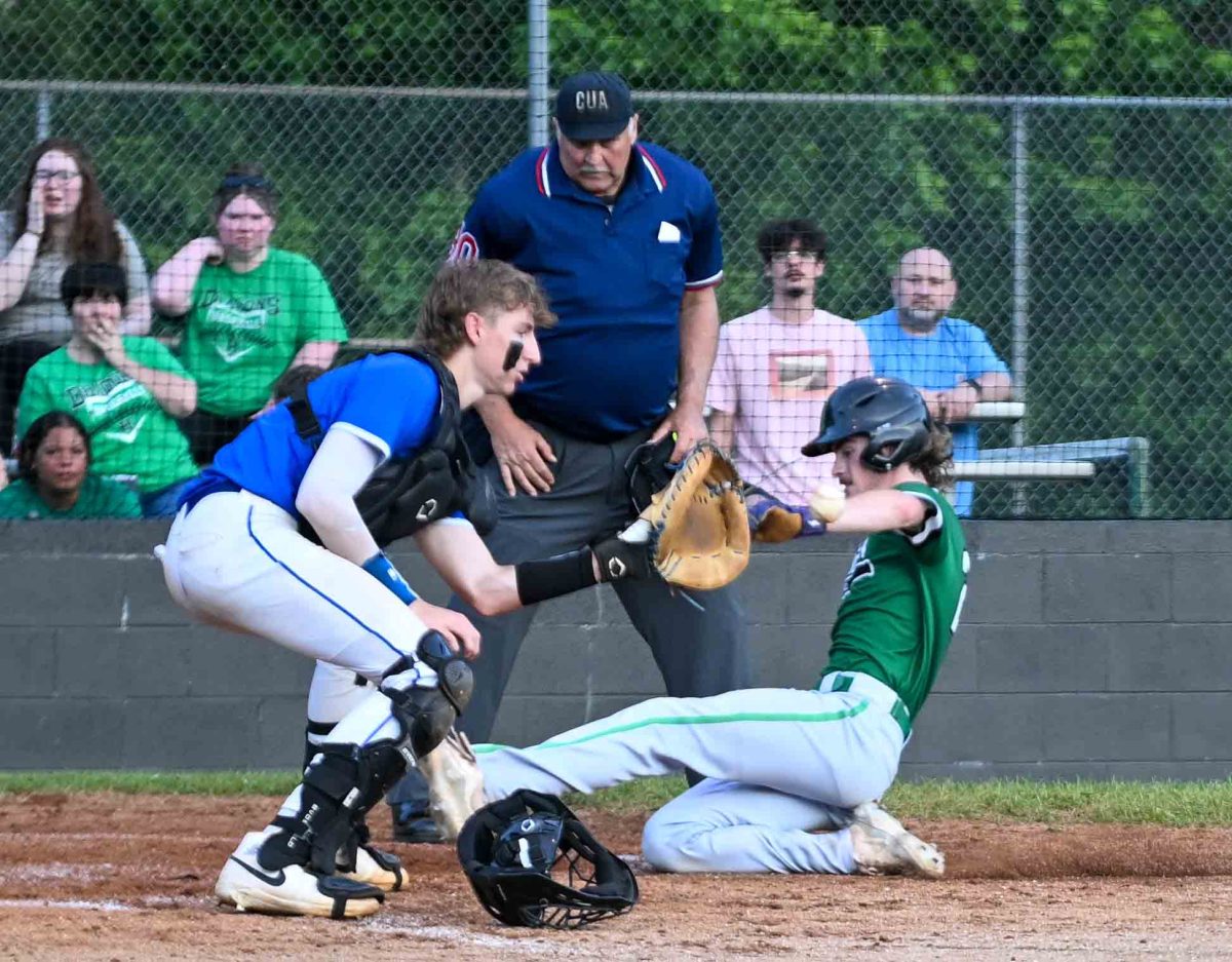 Harlans Chris Rouse slid home with a run in the second inning on a double by Brody Owens. The Dragons built a 7-0 lead on the way to a 7-5 victory over Bell County.