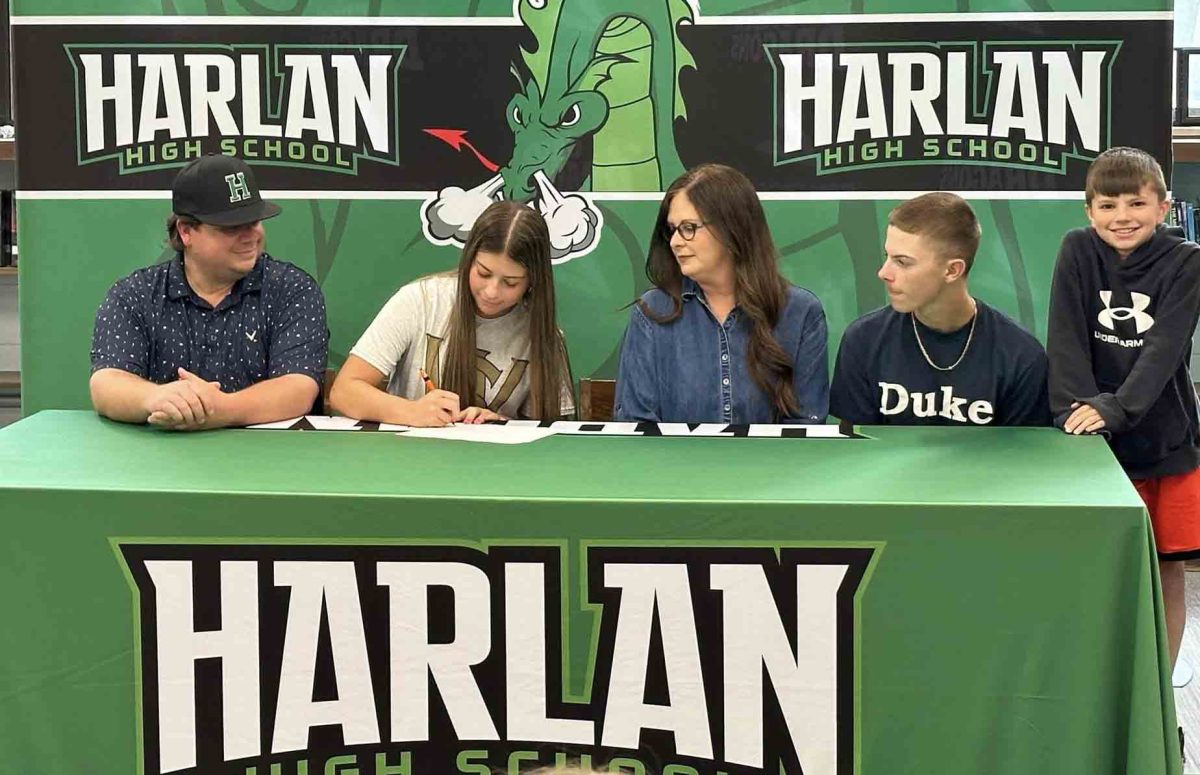 Harlan guard Emma Owens signed recently with Southwest Virginia Community College to continue her academic and athletic career. Owens is pictured with her parents, Chuck and Jo, and her brothers, Brody and Xander.