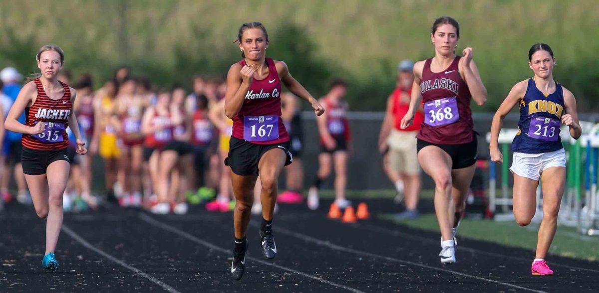 Harlan County senior Ella Karst won both the 100- and 200-meter dash at the Region 7 meet to help the Lady Bears capture the team title.